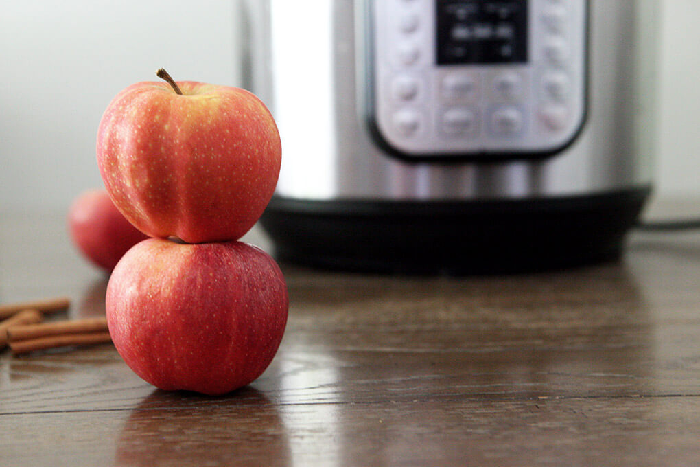 How to Make Instant Pot Apple Cider www.sarahkayhoffman.com stacked apples #applecider #instantpot #instantpotrecipes #healthyliving #glutenfree