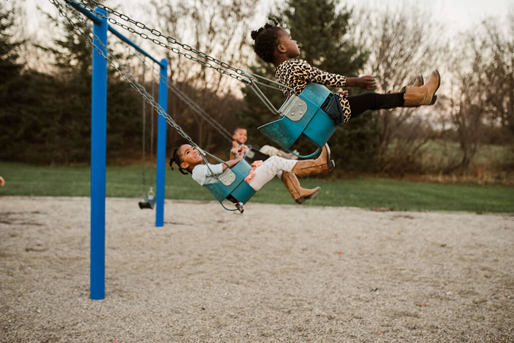 This is Us www.sarahkayhoffman.com #adoption #fostercareadoption #adopt #lifestyleblogger swinging swing set playground