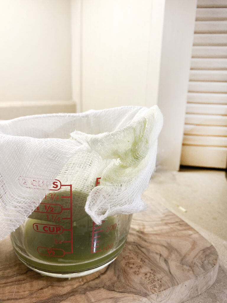 How to Make Celery Juice in a blender cheesecloth agutsygirl.com #celeryjuice #celeryrecipes #celeryjuicebenefits